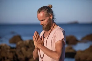 Michaël Bijker with hands in prayer position, pranayama instructor